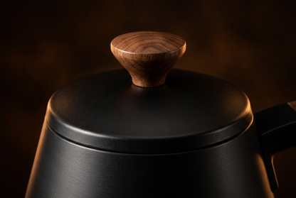 Close-up of black lid and matching brown lid knob